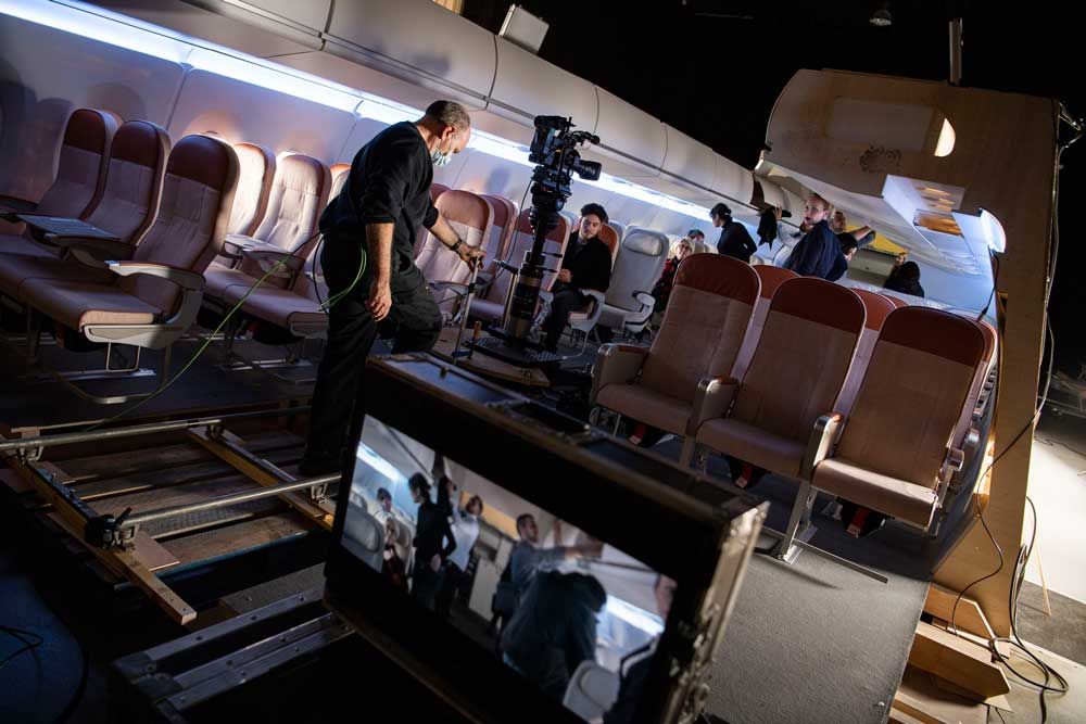 tournage décor d'avion cabine éco